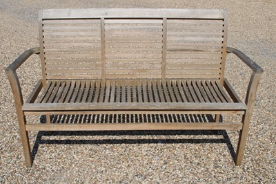 Lot 453 - A teak garden bench
