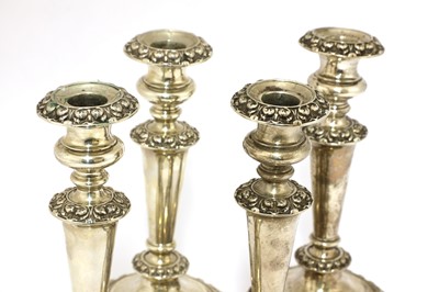 Lot 27 - A set of four William IV silver candlesticks