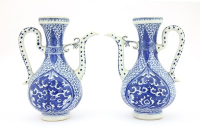 Lot 155 - A pair of Chinese blue and white ewers