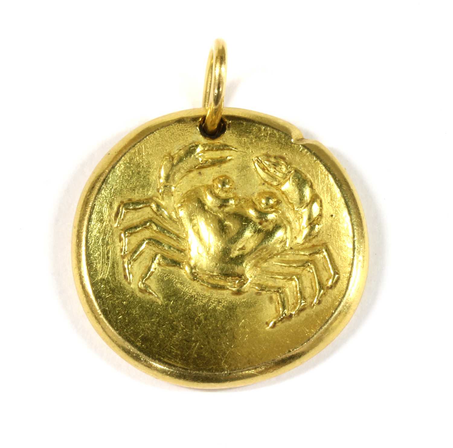 Lot 57 - A French 18ct gold Cancer zodiac pendant, by