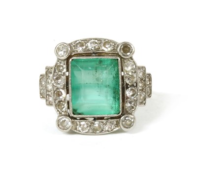 Lot 77 - An Art Deco style platinum and white gold, emerald and diamond ring