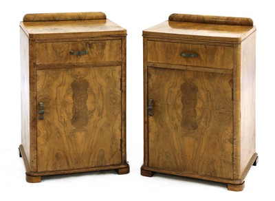 Lot 519 - A pair of Art Deco walnut bedside cabinets