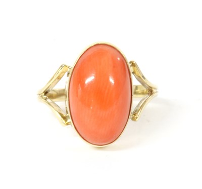Lot 212 - A gold single stone coral ring