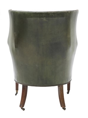Lot 849 - A barrel back armchair