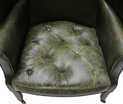 Lot 849 - A barrel back armchair