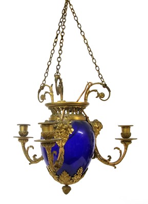 Lot 241 - A blue glass and gilt-bronze three-light chandelier