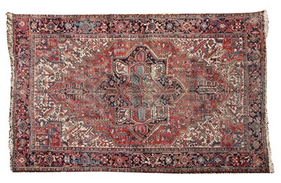 Lot 895 - A Persian Heriz carpet