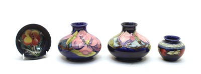 Lot 166 - A pair of Moorcroft tubeline decorated vase