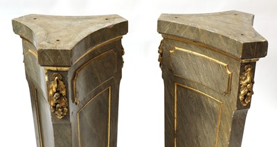 Lot 404 - A pair of faux marble pedestals