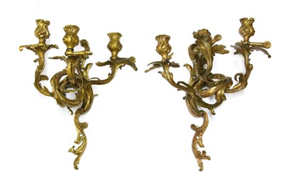 Lot 824 - A pair of Louis XV-style bronze three-branch wall lights