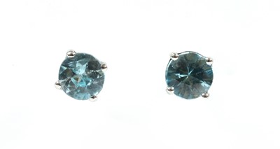 Lot 94 - A pair of white gold blue zircon stud earrings