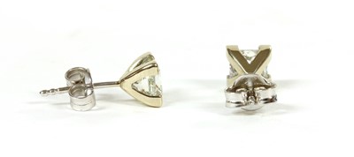 Lot 138 - A pair of white gold single stone diamond stud earrings