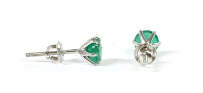 Lot 193 - A pair of white gold single stone emerald stud earrings