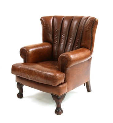 Lot 753 - A George III style, leather upholstered barrel backed armchair