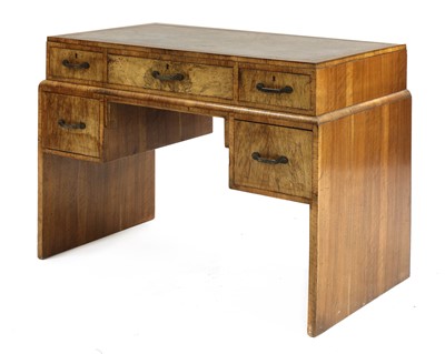 Lot 404 - An Art Deco walnut desk