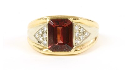 Lot 211 - A Continental gold garnet and diamond ring