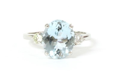 Lot 216 - An Italian white gold three stone aquamarine and diamond ring