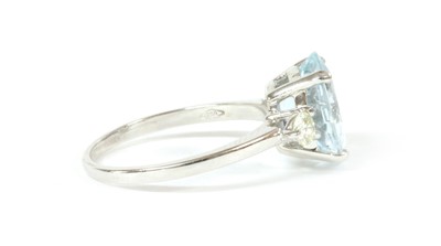 Lot 216 - An Italian white gold three stone aquamarine and diamond ring
