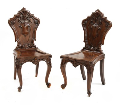 Lot 677 - A pair of Victorian mahogany hall chairs