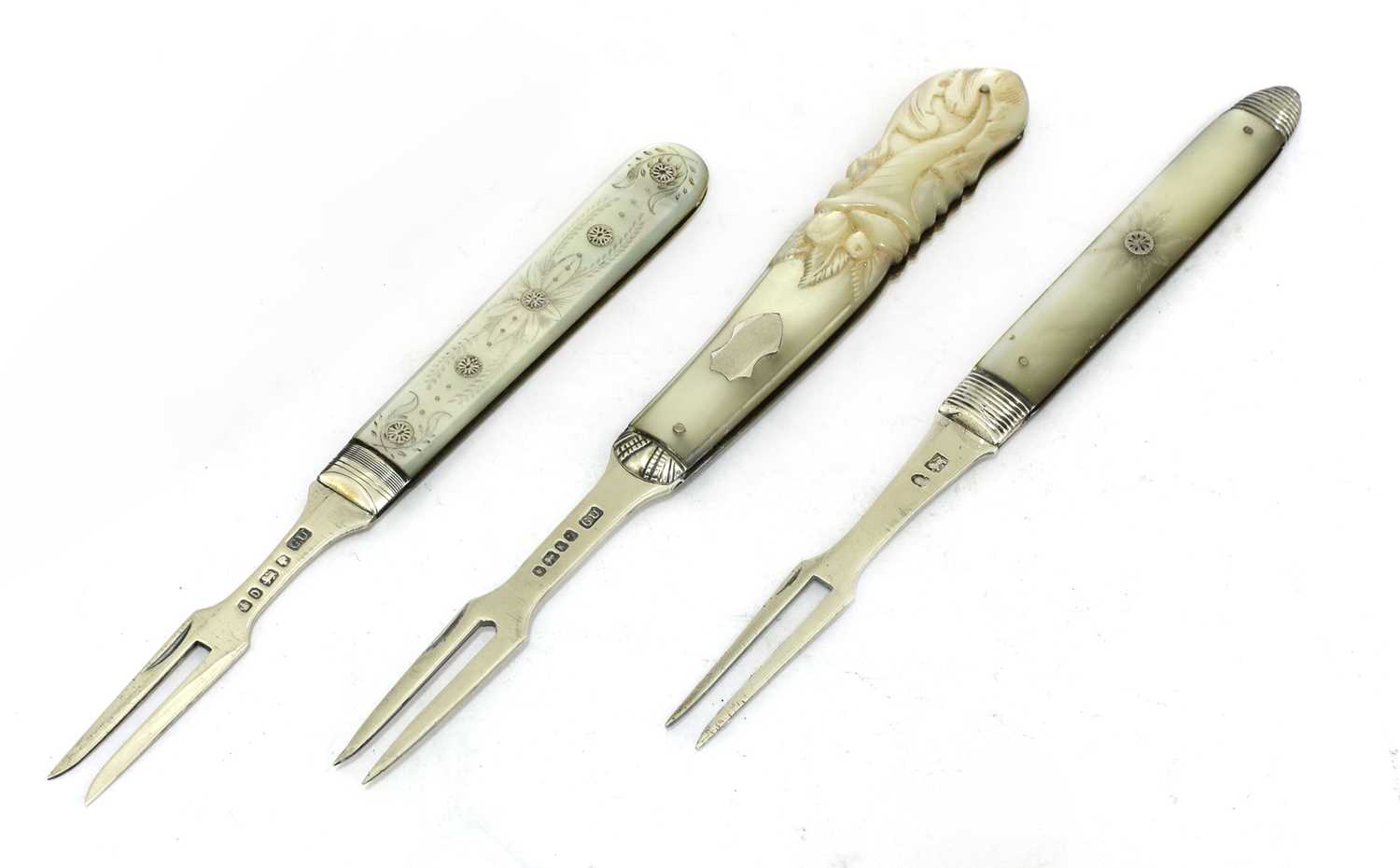 Lot 31 - Three silver and mother-of-pearl folding fruit forks