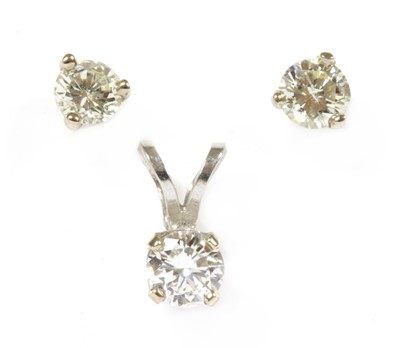 Lot 246 - A white gold single stone diamond pendant