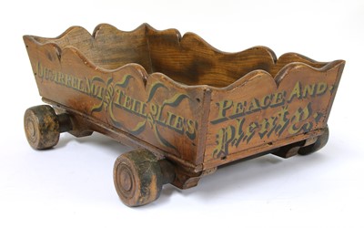 Lot 791 - A Victorian elm and inscribed truckle