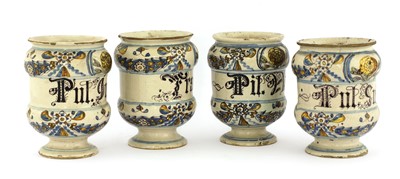 Lot 379 - A set of four Italian majolica apothecary jars