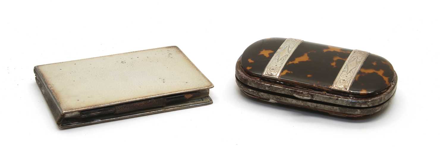Lot 9 - A 19th century silver and tortoiseshell purse of ovoid shape