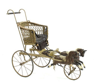 Lot 627 - An early 20th century child's carriage