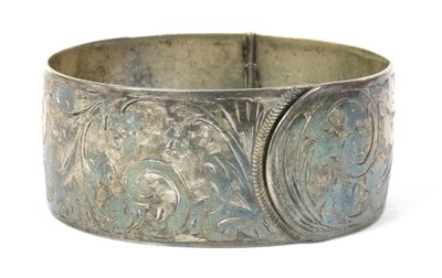 Lot 381 - A sterling silver hinged bangle, by Charles Horner