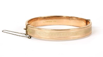 Lot 298 - A 9ct gold oval hollow hinged bangle