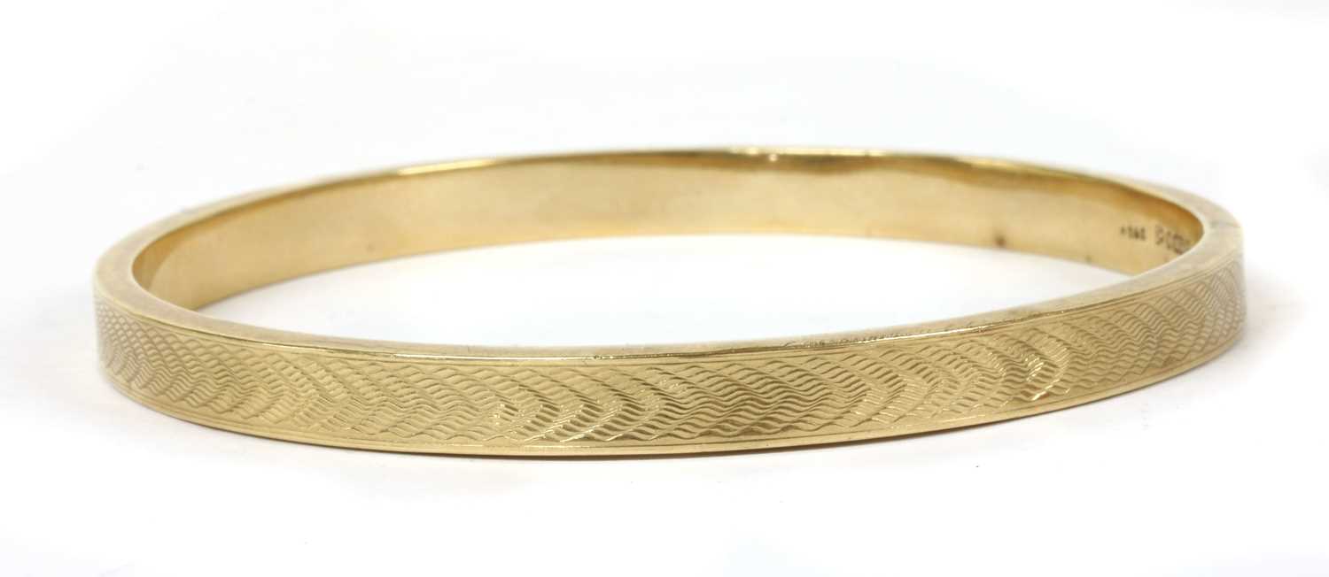 Lot 296 - A 9ct gold hollow bangle