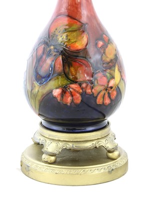 Lot 212 - A Moorcroft flambé 'Orchid' table lamp