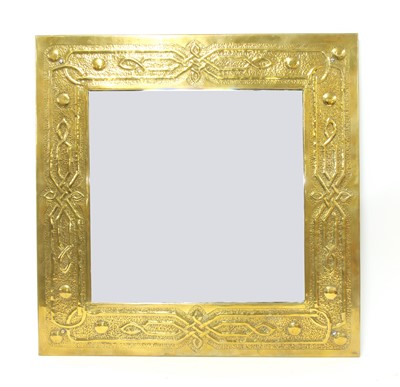 Lot 37 - An Arts and Crafts embossed brass mirror