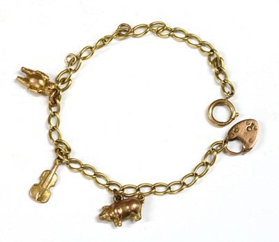 Lot 290 - A gold charm bracelet