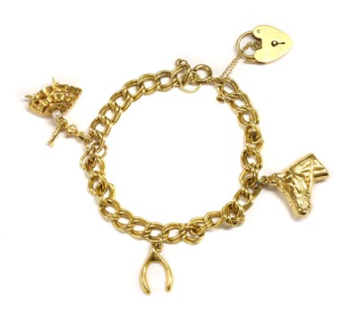 Lot 288 - A 9ct gold charm bracelet, c.1970