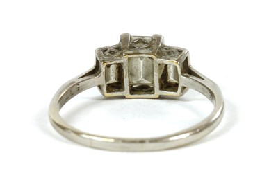 Lot 73 - A platinum three stone diamond ring