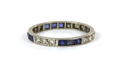 Lot 72 - A platinum sapphire and diamond full eternity ring