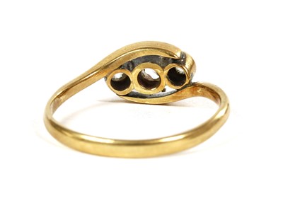 Lot 161 - A gold three stone diamond crossover ring