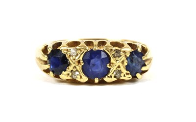 Lot 196 - A gold three stone sapphire ring