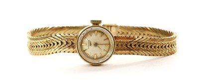 Lot 230 - A ladies' 9ct gold Longines mechanical bracelet watch, c.1960