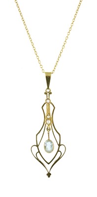 Lot 125 - An Edwardian gold aquamarine and split pearl pendant