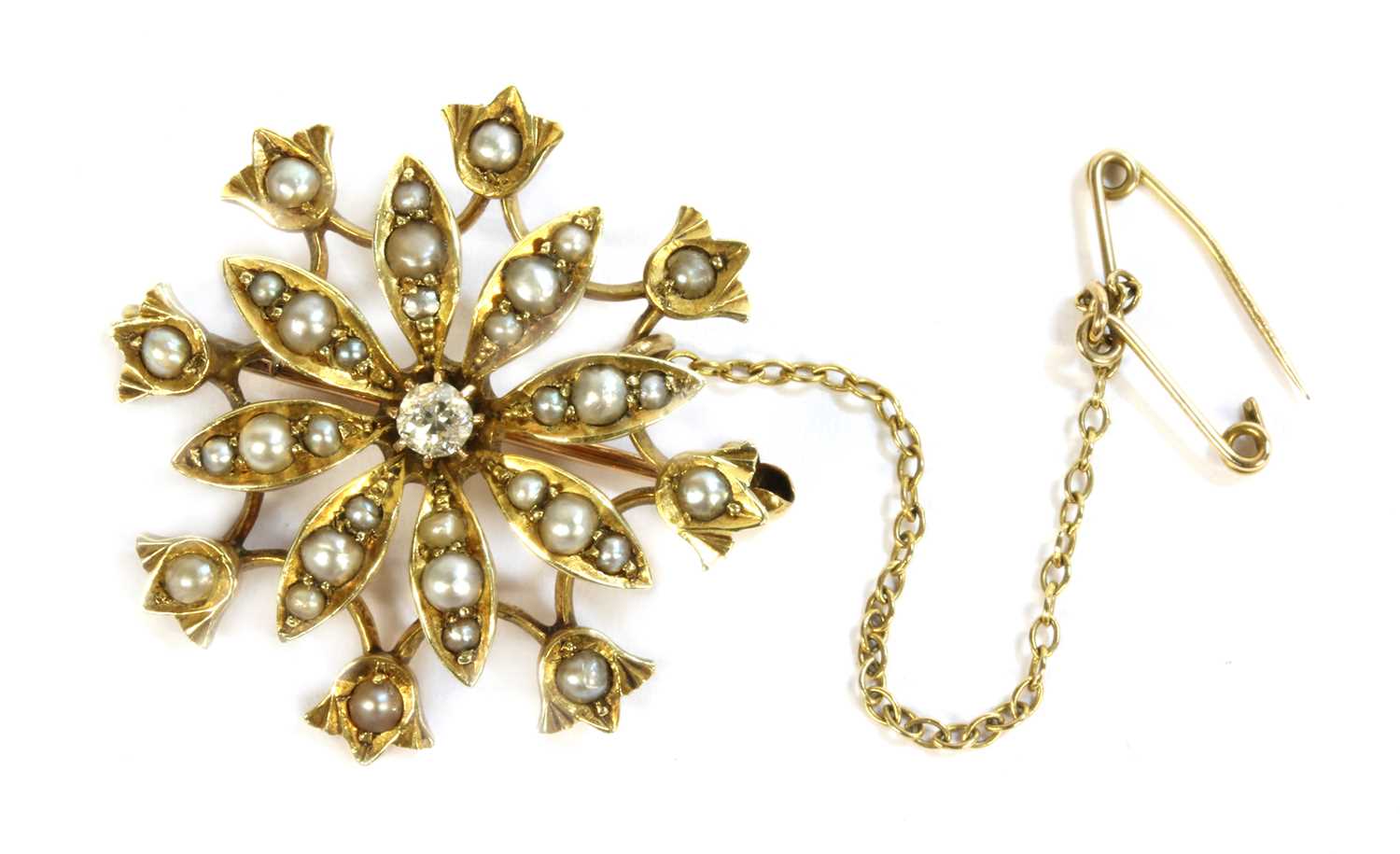 Lot 27 - An Edwardian gold diamond and split pearl flower head brooch