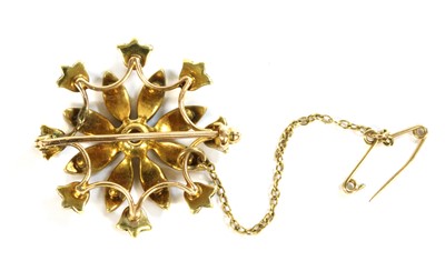 Lot 27 - An Edwardian gold diamond and split pearl flower head brooch
