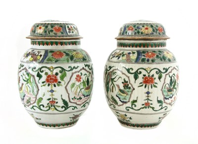 Lot 335 - A pair of famille verte jars and covers