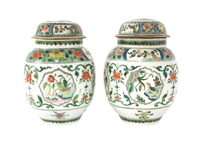 Lot 335 - A pair of famille verte jars and covers