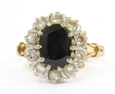 Lot 140 - A gold sapphire and diamond cluster ring