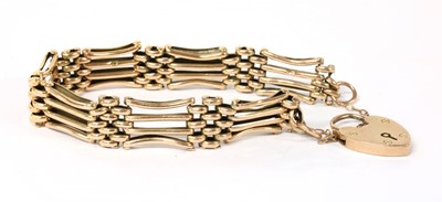 Lot 305 - A gold gate link bracelet