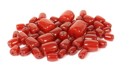 Lot 85 - A quantity of graduated cherry coloured barrel shaped Bakelite beads