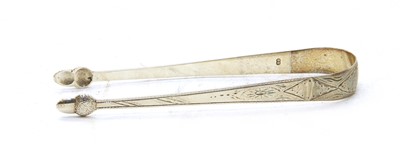 Lot 60 - A pair of George III silver sugar tongs